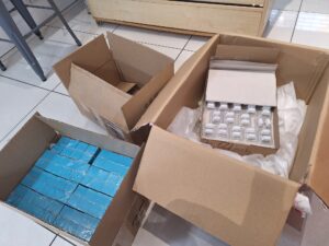 Boxes of Cleany Teeth products and replacement brush heads