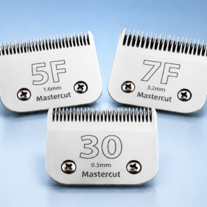 Three professional clipper blades (10, 7F, and 30) displayed on a soft blue background, representing replacement blades used for dog grooming and coat maintenance.